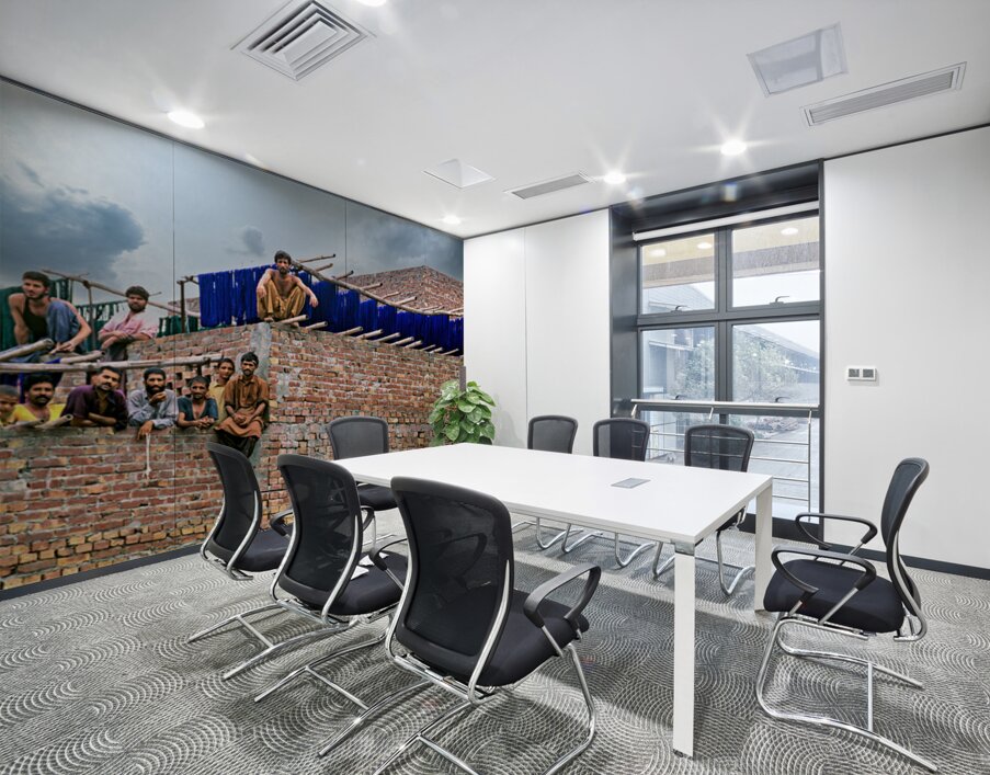 Workers rest during break time at a construction site in Lahore Wall Printing