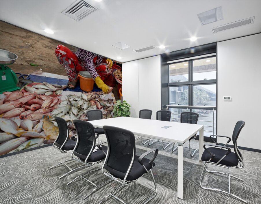 Fish seller in Phu Quoc market shows fresh catch for sale Wall Printing