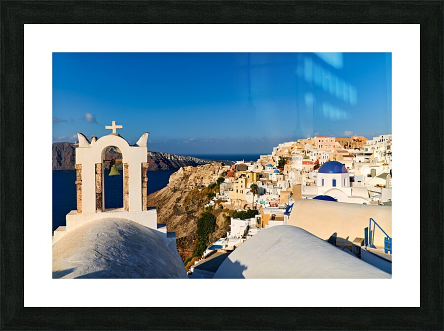 Santorini village with church bell tower overlooking caldera. Picture Frame print