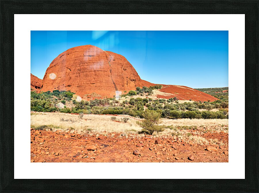 Vast red rock formation under a clear blue sky. Picture Frame print