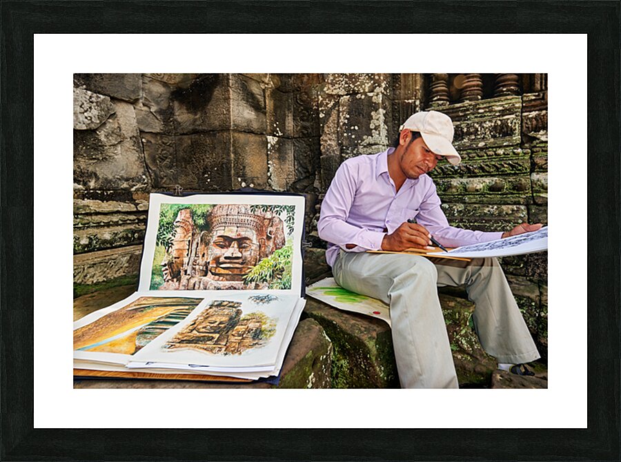 Artist drawing ancient temple carvings outdoors. Picture Frame print