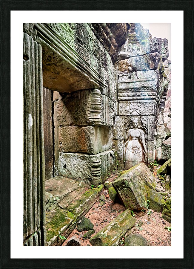 Ancient temple ruins with carved stone deity and moss. Picture Frame print