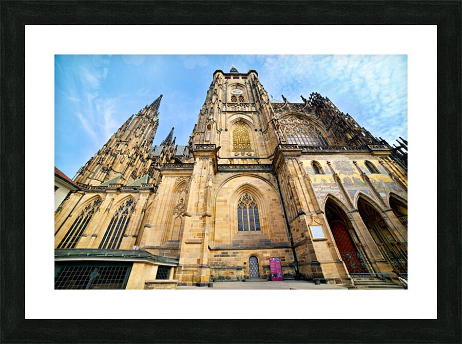 Ornate St. Vitus Cathedral facade against a blue sky. Picture Frame print