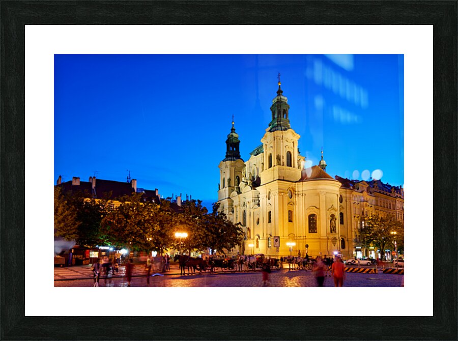 Illuminated church and lively square at night. Picture Frame print