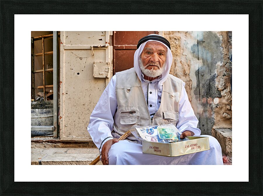 Old man sitting with sweets in Jerusalems old city Picture Frame print