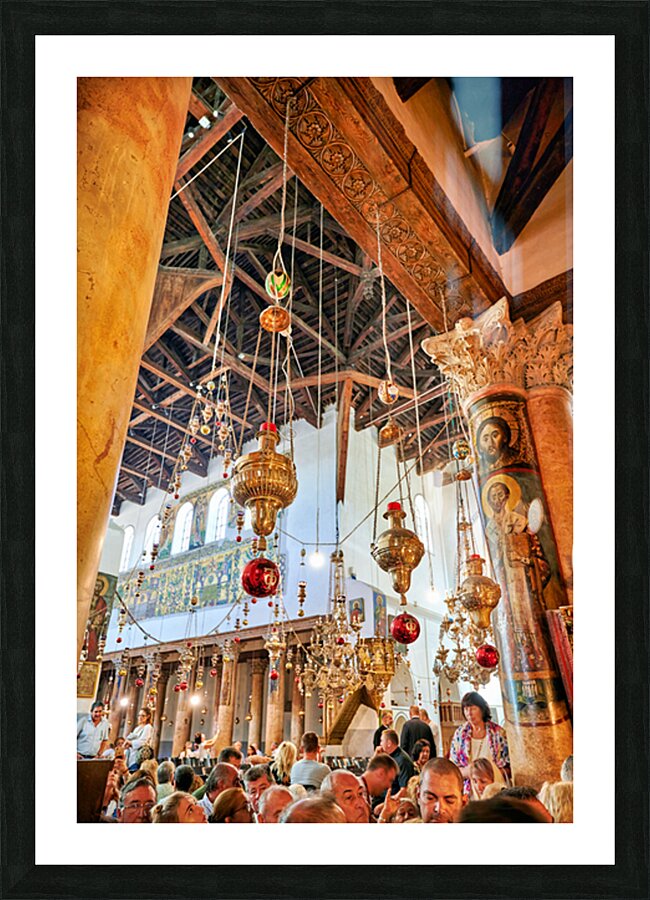 Visitors gather inside the church of the nativity in Bethlehem Picture Frame print