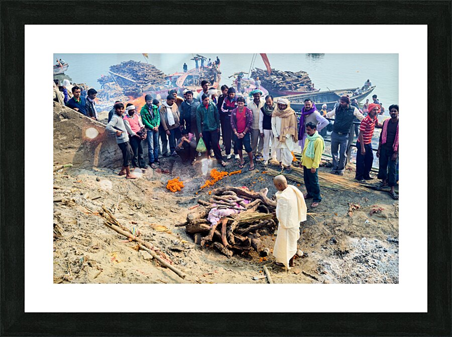 Cremation rites by the Ganges River in Varanasi India Picture Frame print