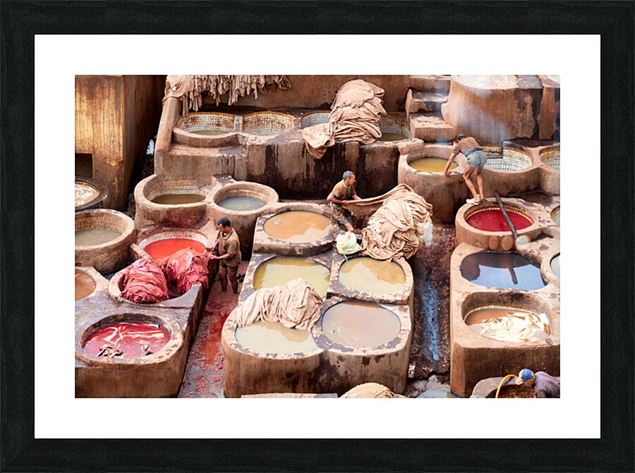 Workers dye leather at Chouara Tannery in Fez Morocco Picture Frame print