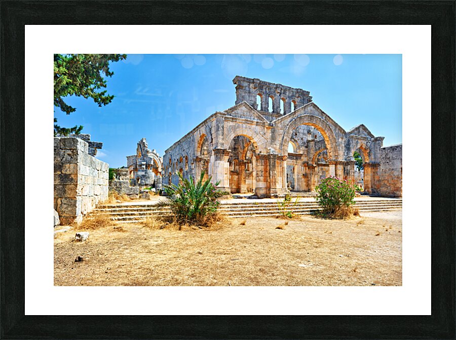 Visitors explore the ruins of Church of Saint Simeon Stylites in Picture Frame print
