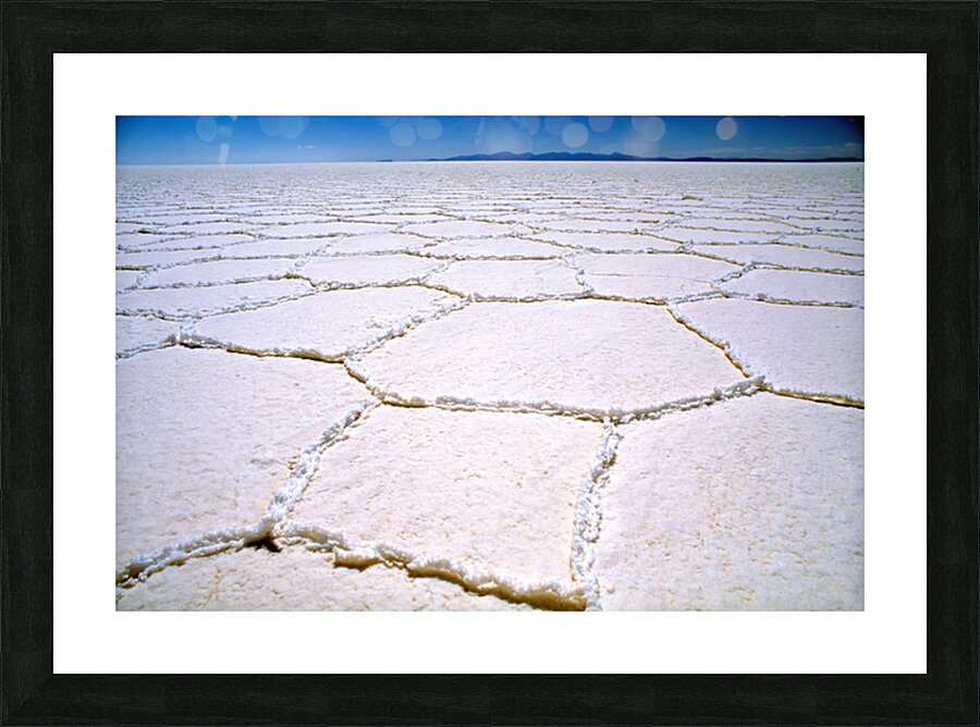 Expansive white salt flat with geometric patterns. Picture Frame print
