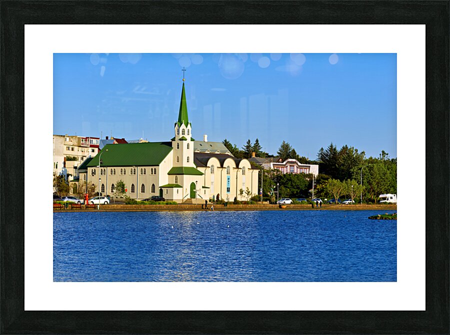 Lutheran Free Church near Lake Tjornin in Reykjavik Iceland Picture Frame print