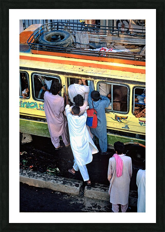 People boarding a bus in Lahore during busy hours Picture Frame print