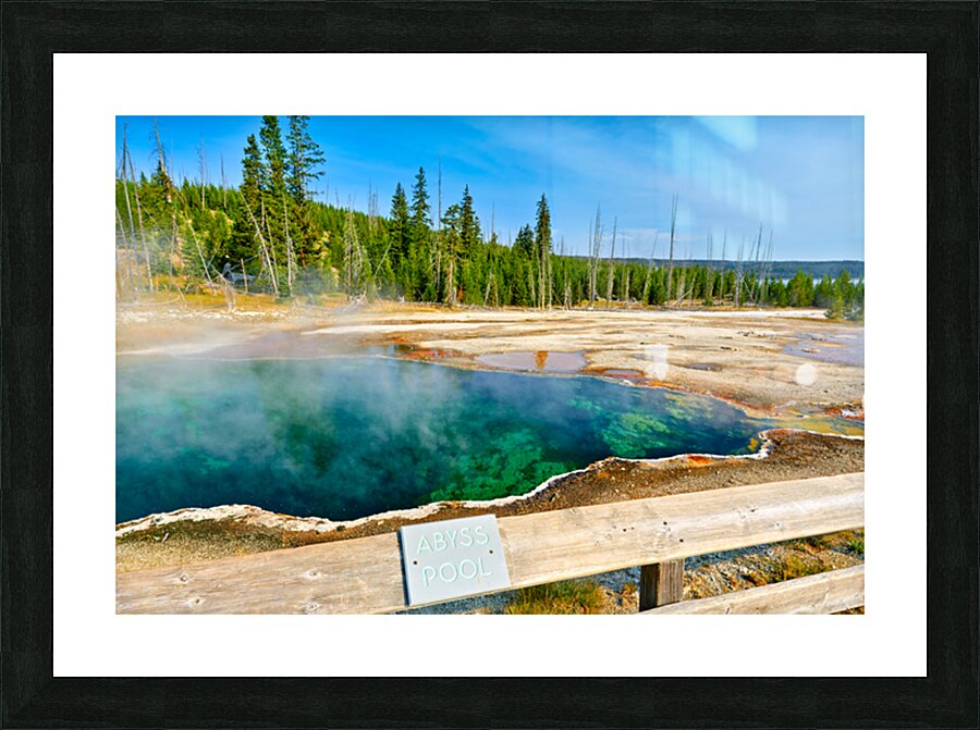 Tourists can see the deep blue Abyss Pool in Yellowstone National Park with steam rising from the hot springs during the warm afternoon. Picture Frame print