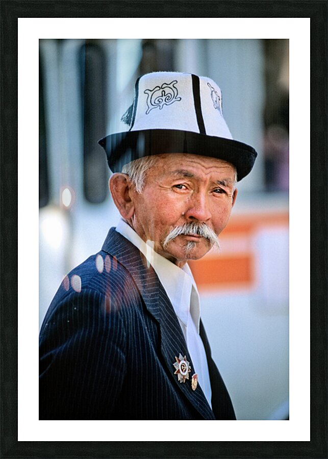 Elderly man in traditional hat walks in Bukhara Uzbekistan Picture Frame print