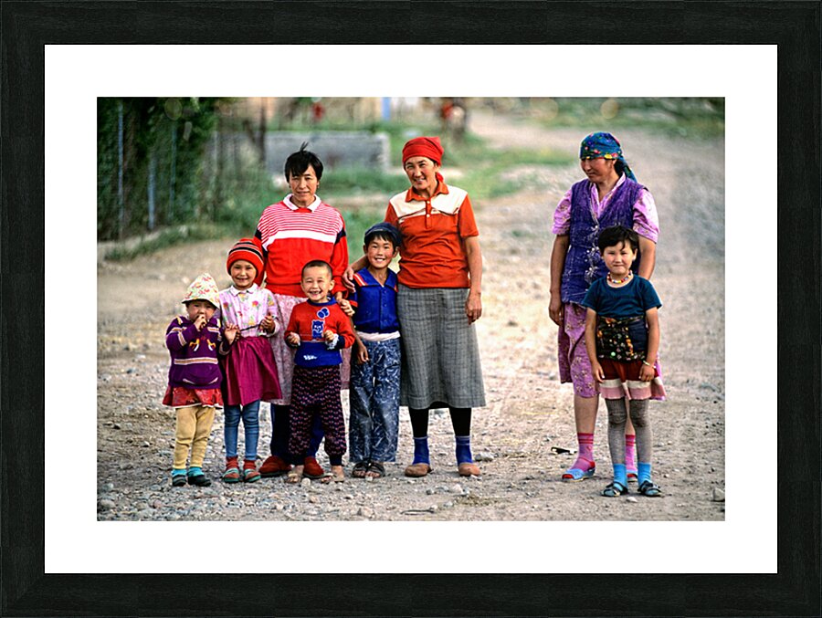 Children and women gather in a village in Uzbekistan Picture Frame print