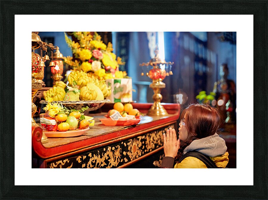 Person offers prayers at altar with fruits in Ho Chi Minh Picture Frame print