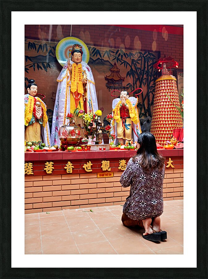 Prayer at Buddhist shrine in Ho Chi Minh City Vietnam Picture Frame print
