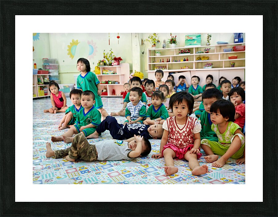 Children gather in classroom in Ho Chi Minh City during lesson Picture Frame print
