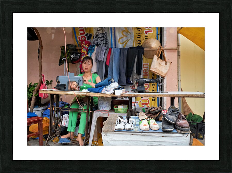 Sewing clothes at a market stall in Phu Quoc Vietnam Picture Frame print