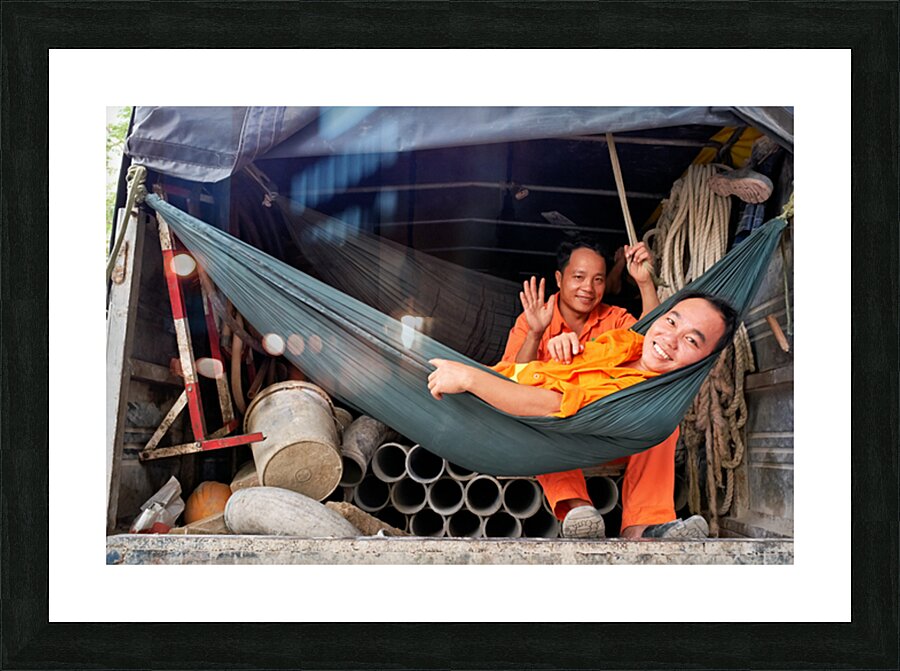 Workers relax in a truck in Ho Chi Minh City Vietnam Picture Frame print