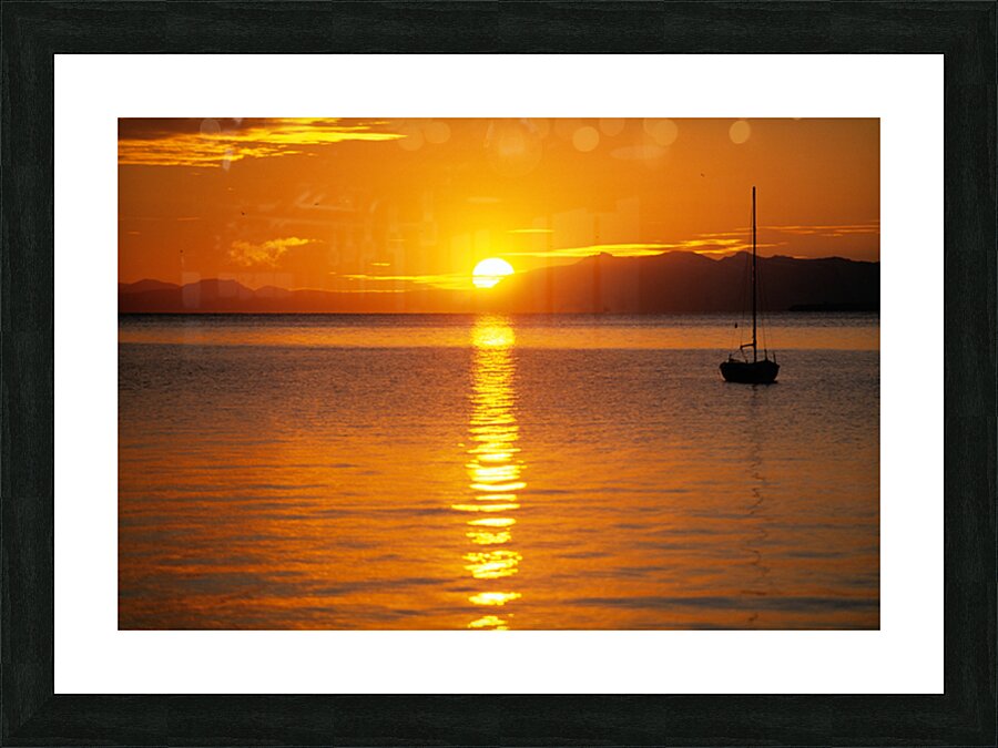 Midnight sun at Longyearbyen in Svalbard with a boat on the water Picture Frame print