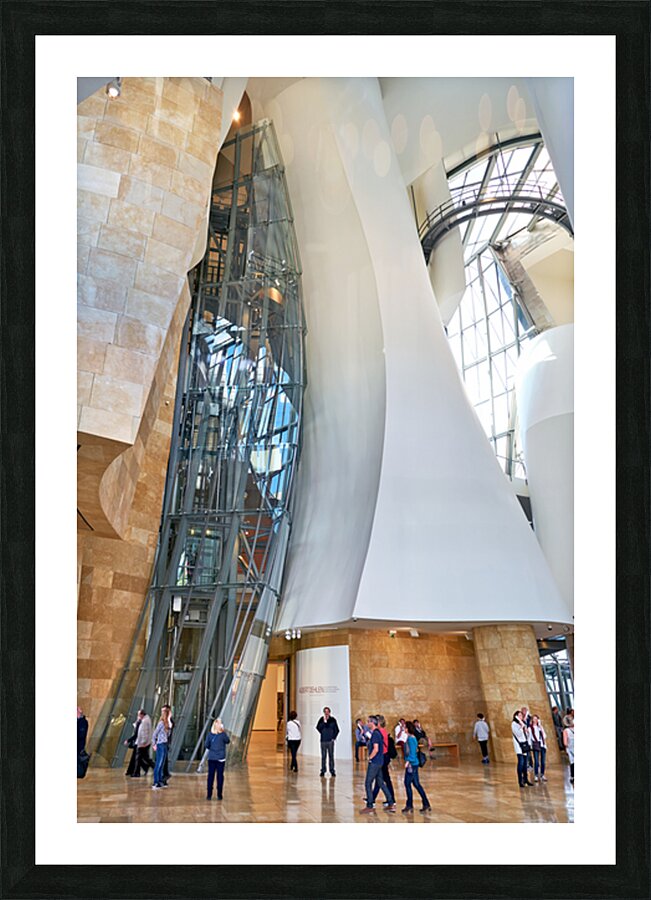 Visitors explore the interior of the Guggenheim Museum in Bilbao Picture Frame print