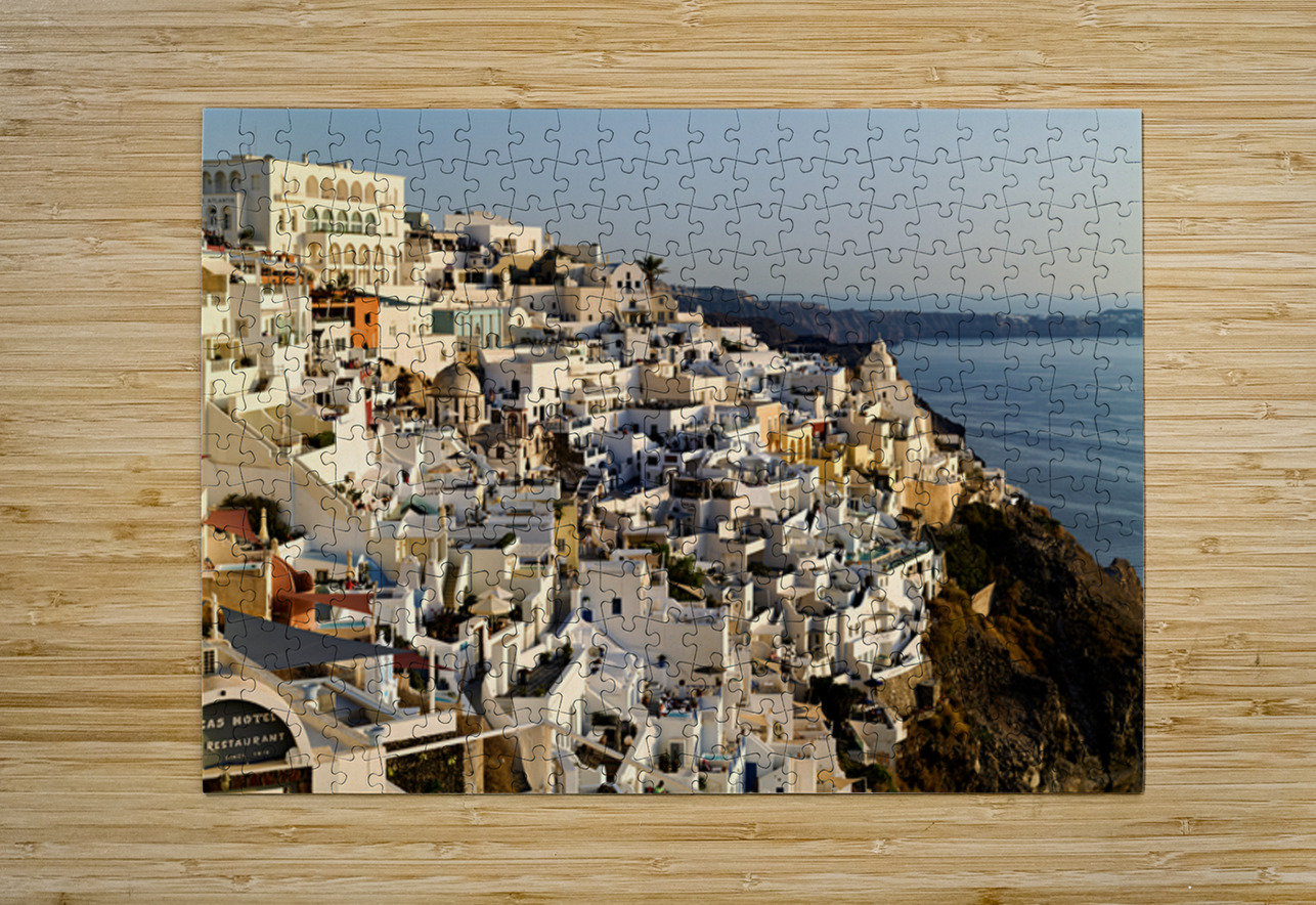 Santorinis white buildings cascade down cliff to the sea. Marco Brivio Puzzle printing