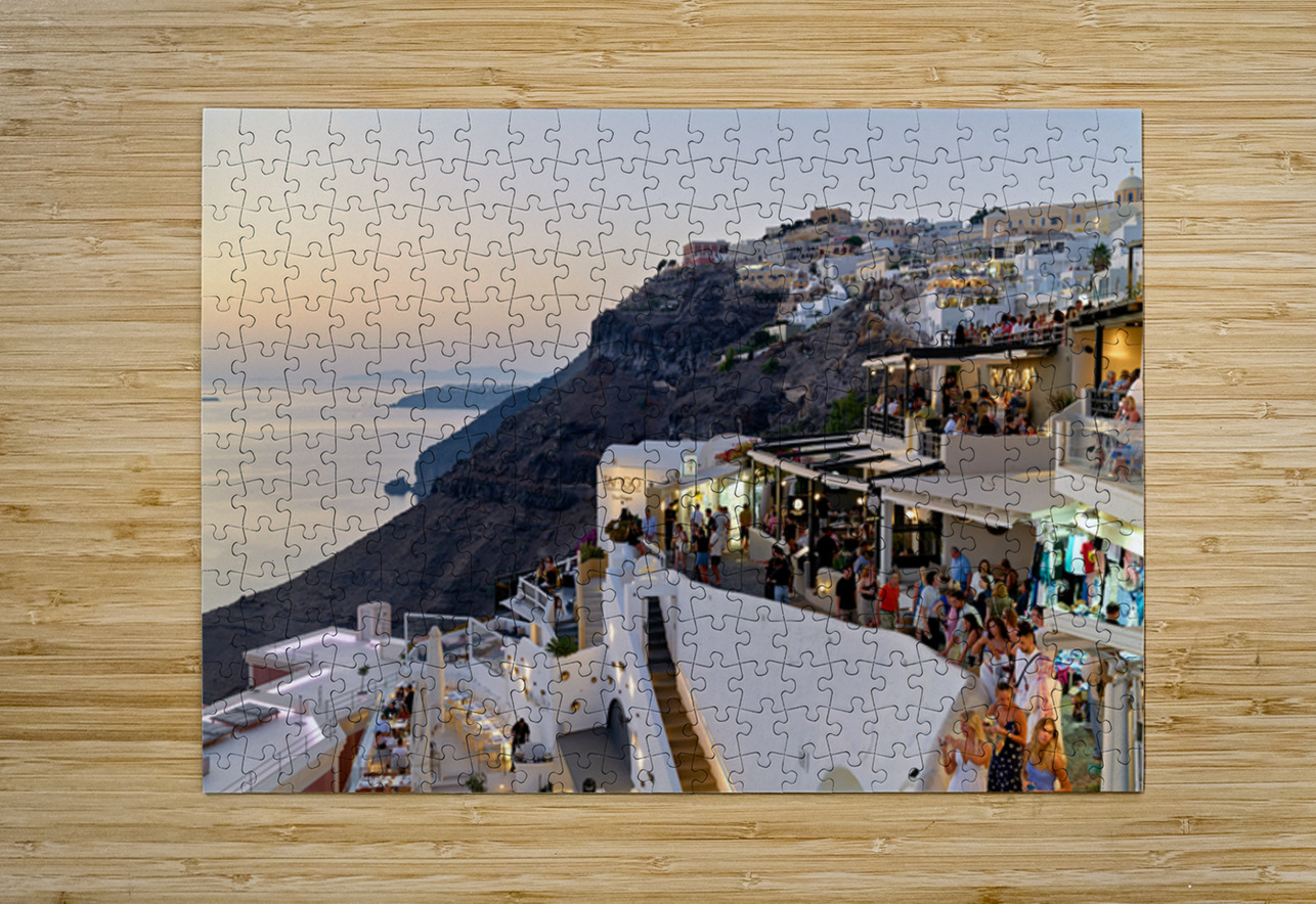 Santorini cliffside town with restaurants and people enjoying th Marco Brivio Puzzle printing