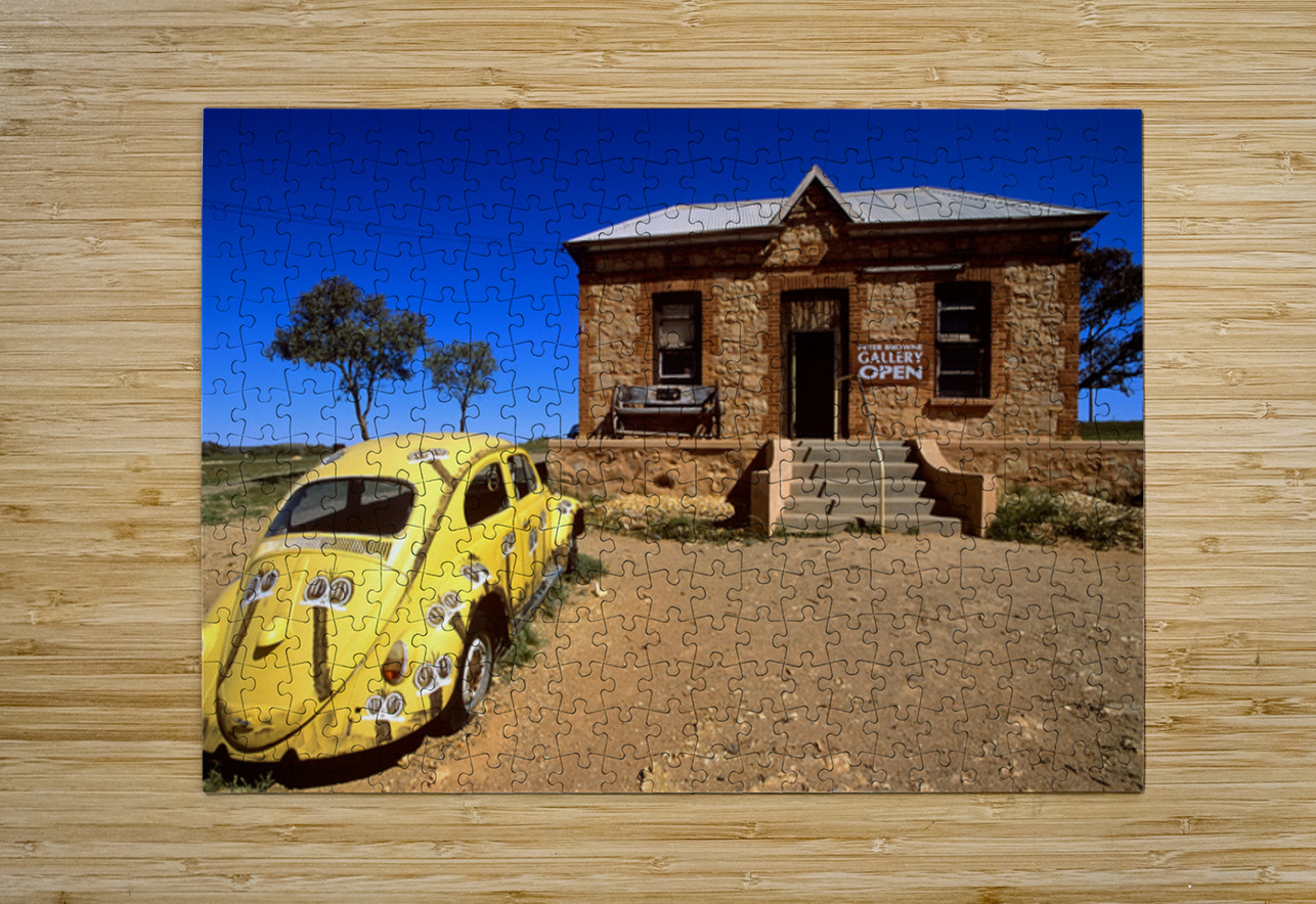 A painted yellow Beetle outside a rural stone gallery. Marco Brivio Puzzle printing