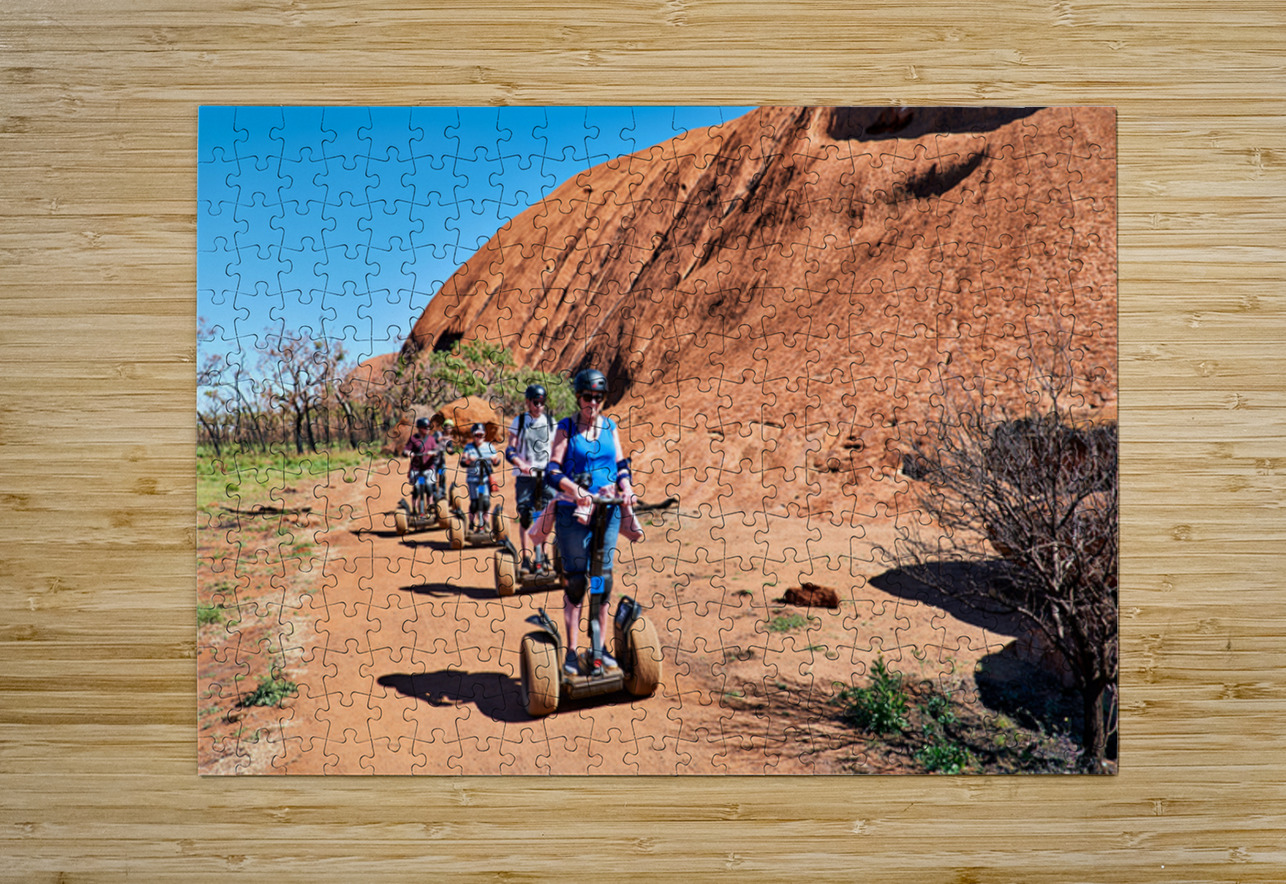 Tourists ride Segways near Uluru in Australia. Marco Brivio Puzzle printing