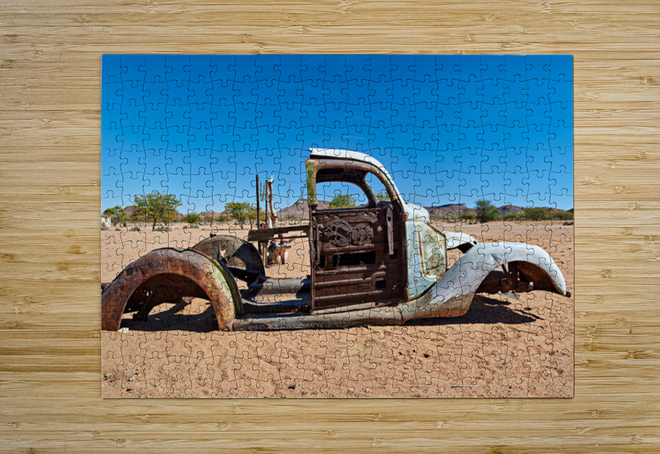 Classic car wreck rests in the Namib desert under a clear sky Marco Brivio Puzzle printing