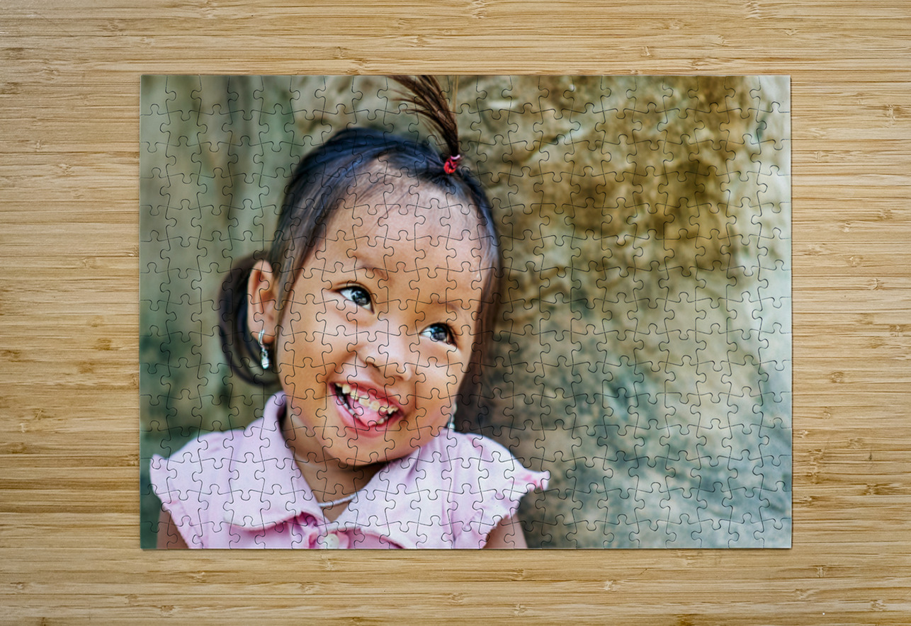 Joyful young girl with a playful smile and tongue out. Marco Brivio Puzzle printing