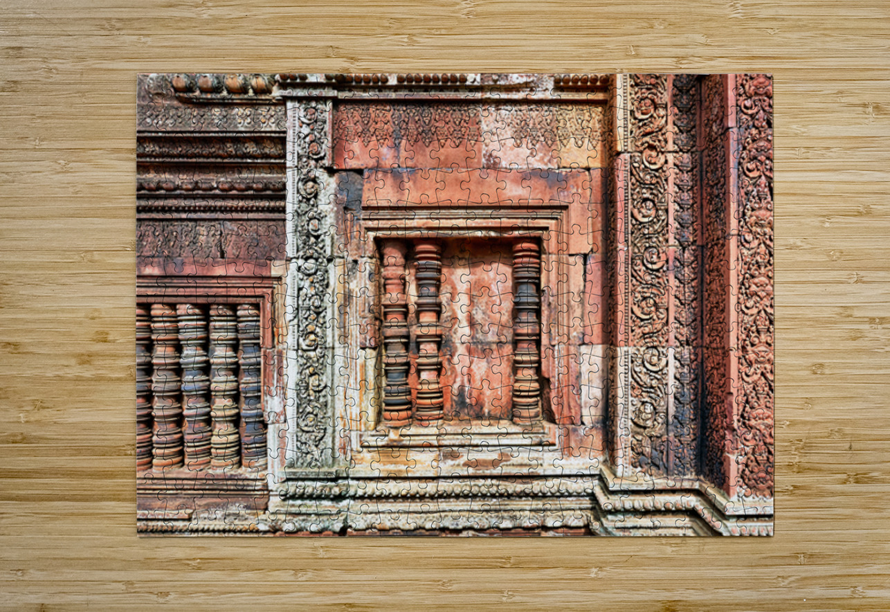 Ancient temple wall with intricate reddish stone carvings and co Marco Brivio Puzzle printing