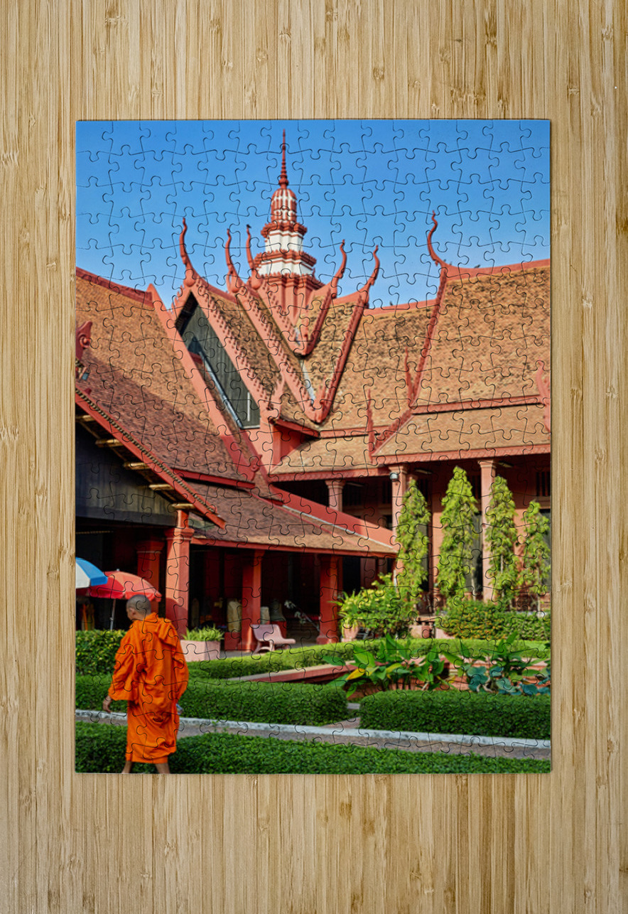Monk walks through traditional Cambodian temple garden. Marco Brivio Puzzle printing