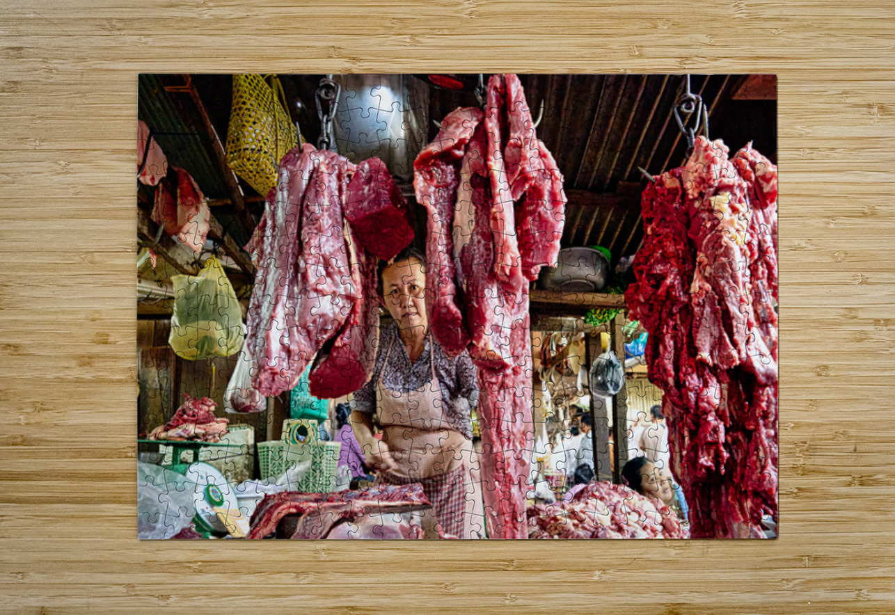 Woman selling raw meat in a bustling market. Marco Brivio Puzzle printing