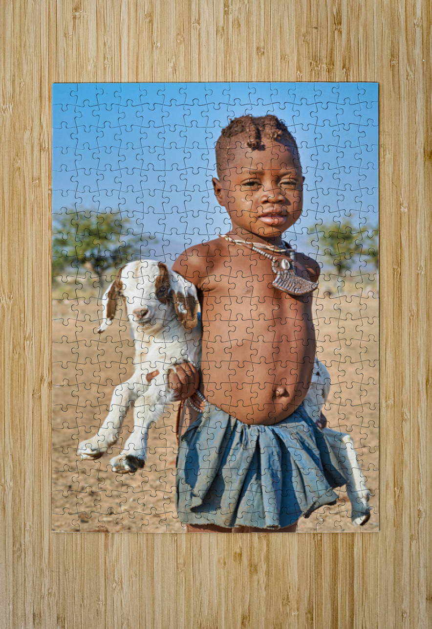 Himba child holding a goat in Kunene Region of Namibia Marco Brivio Puzzle printing