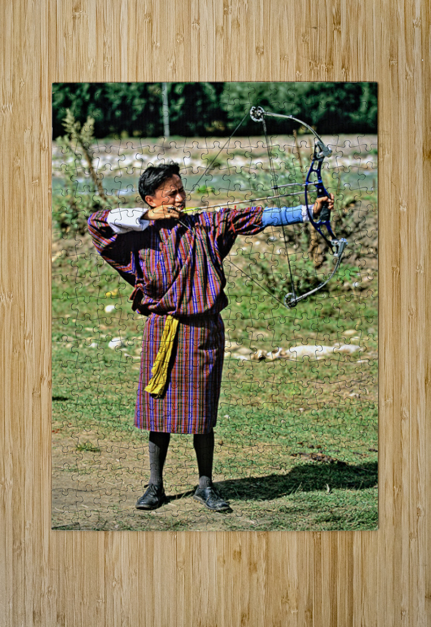 Bhutanese archer in traditional Gho aiming a compound bow. Marco Brivio Puzzle printing
