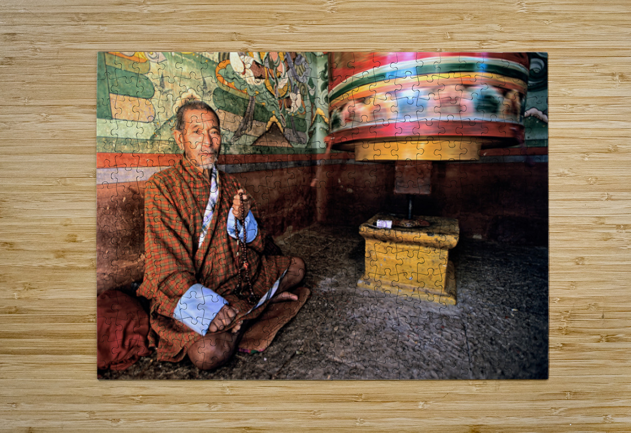 Bhutanese man with prayer beads and spinning prayer wheel. Marco Brivio Puzzle printing