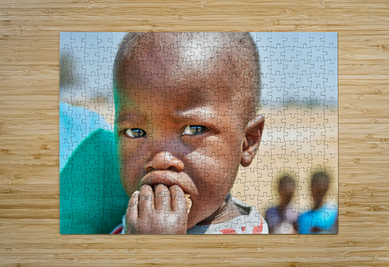 Sad boy in Kavango Region of Namibia looks thoughtful and lost Marco Brivio Puzzle printing