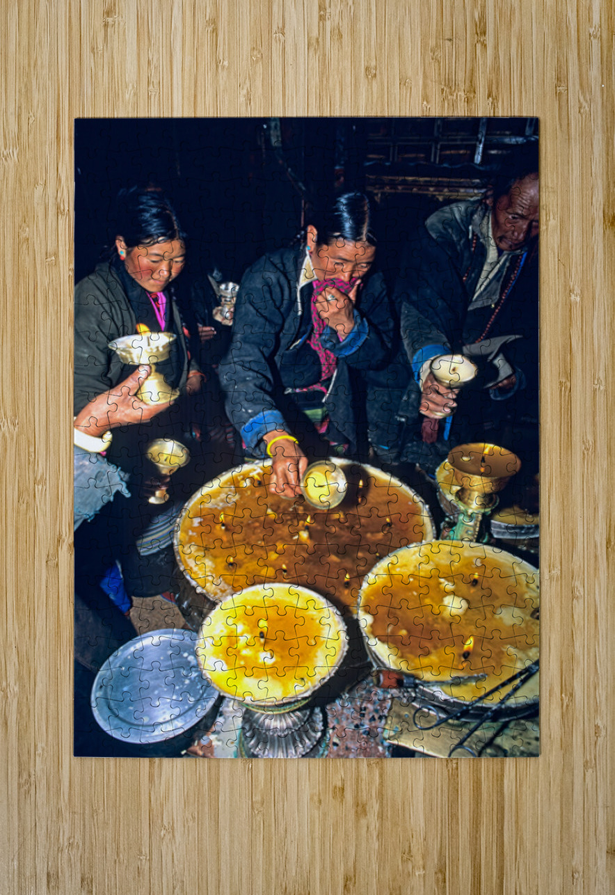 Lighting butter lamps during a ceremony in Tibet Marco Brivio Puzzle printing