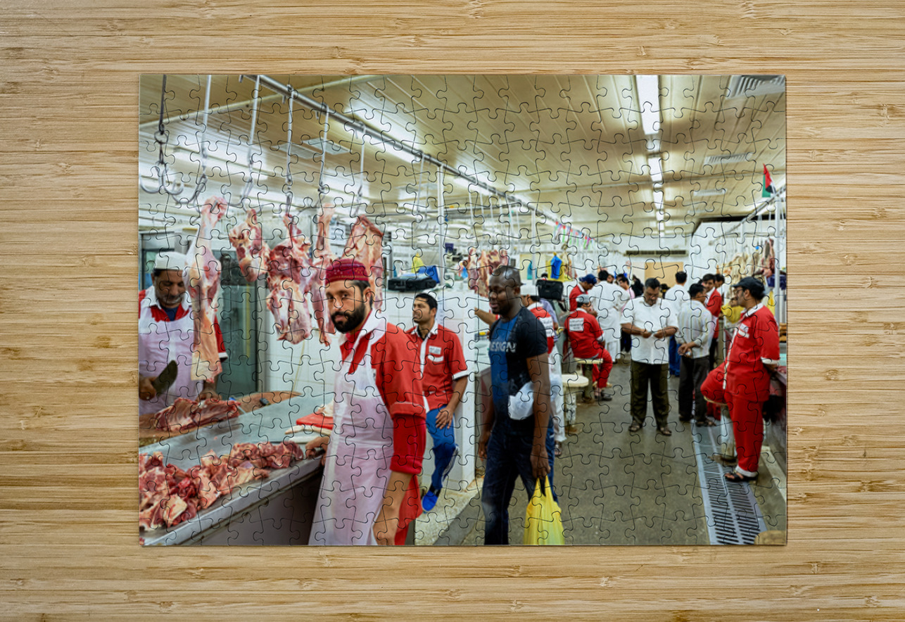 Butchers work at a busy meat market in Dubai UAE preparing fresh Marco Brivio Puzzle printing