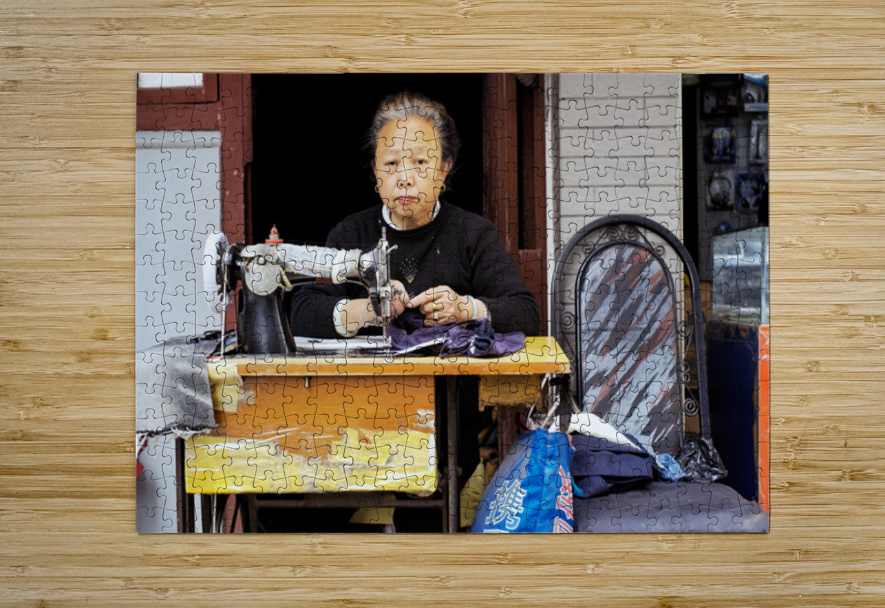 Elderly woman sews at machine in Shanghai China Marco Brivio Puzzle printing