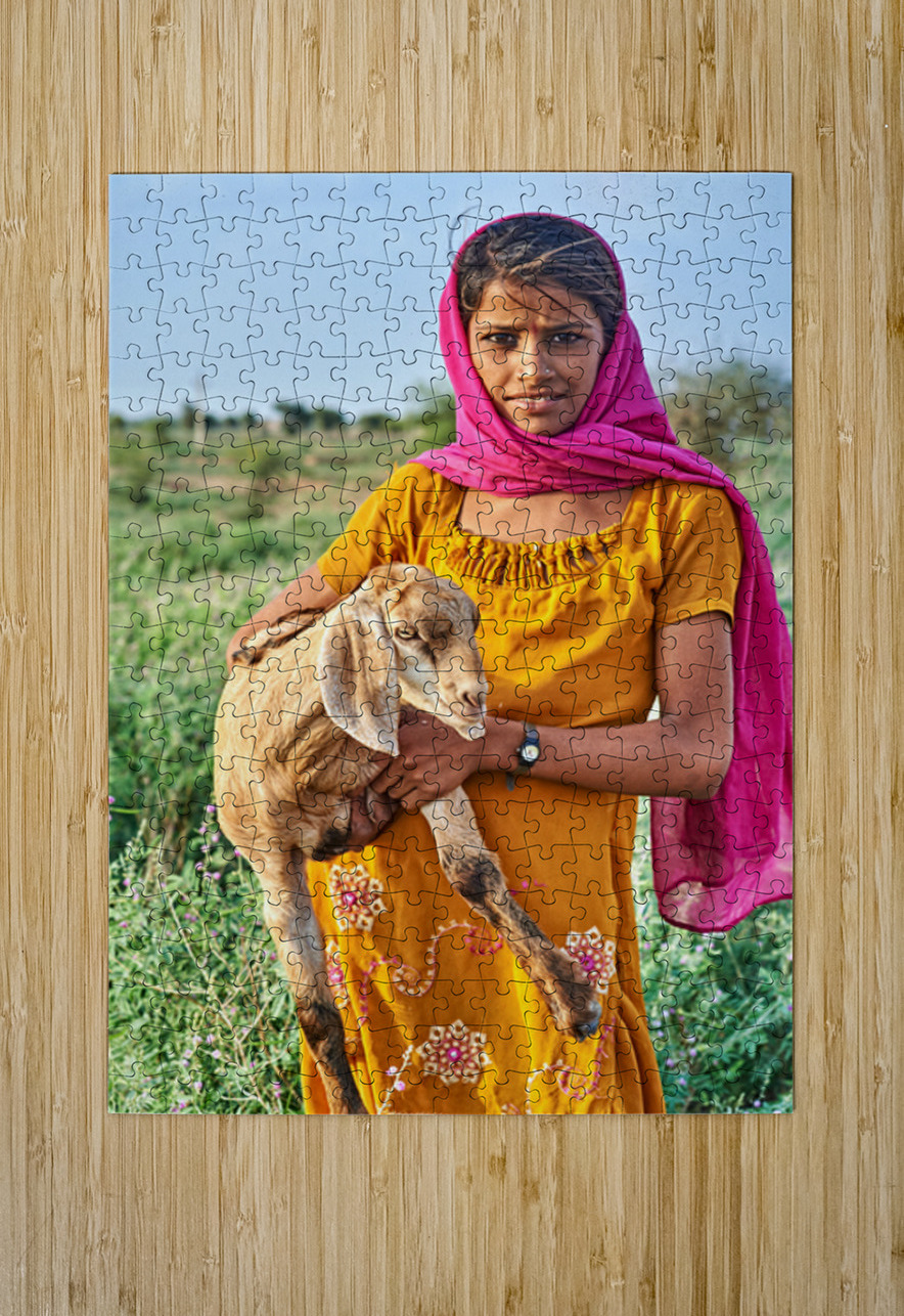 Girl holds goat in Khimsar Rajasthan India during sunny day Marco Brivio Puzzle printing