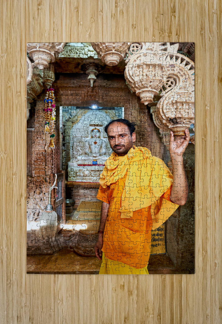 Hindu monk stands near statue in Jaisalmer Jain temple Marco Brivio Puzzle printing