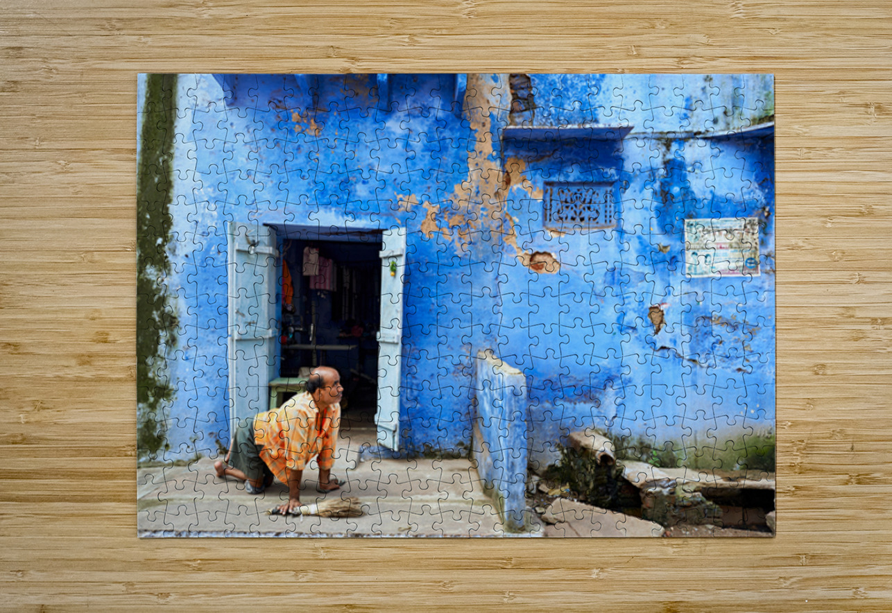 Man sweeps in front of home in Bundi Rajasthan during the day Marco Brivio Puzzle printing