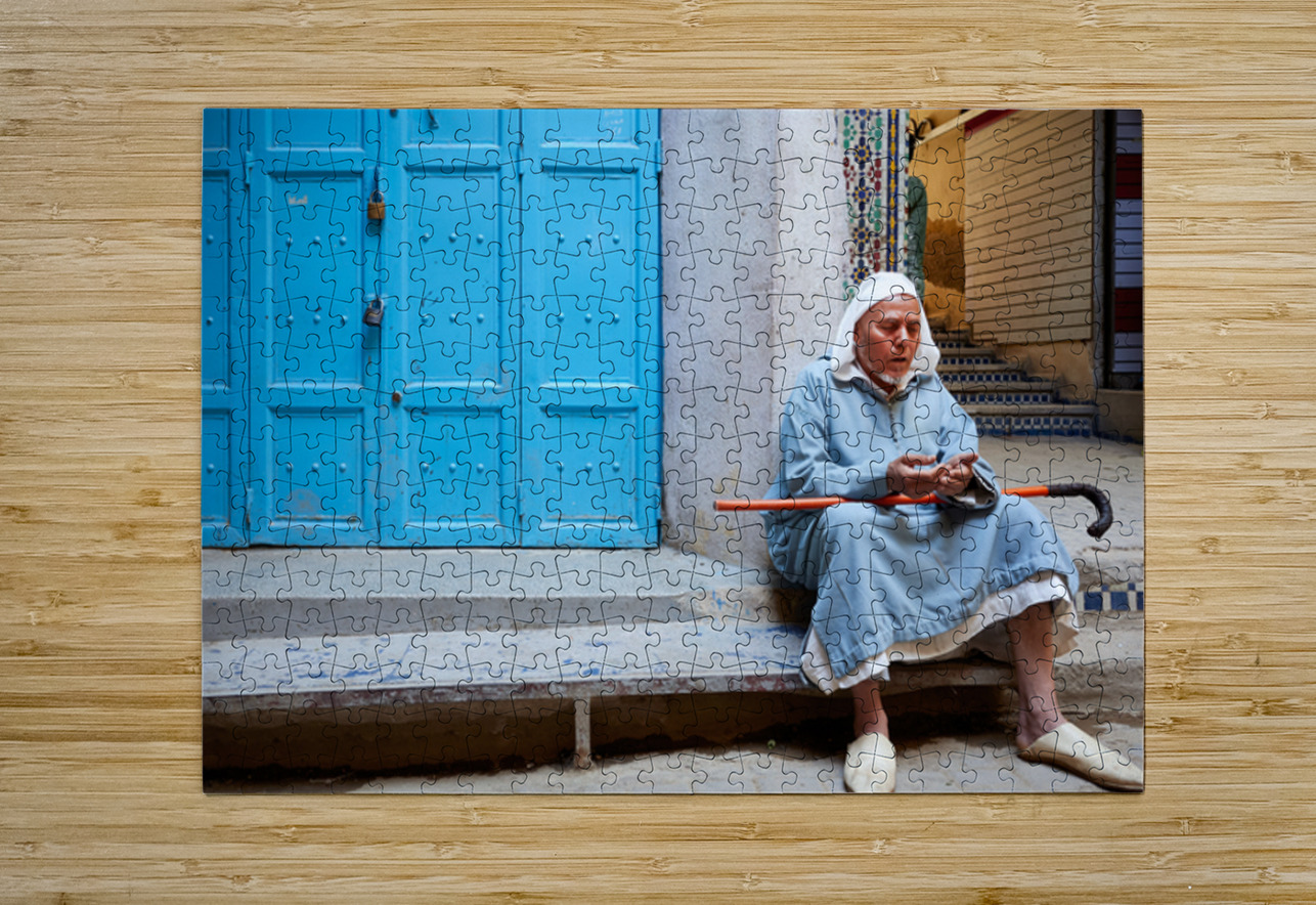Portrait of a beggar sitting by a blue door in Fez Morocco Marco Brivio Puzzle printing