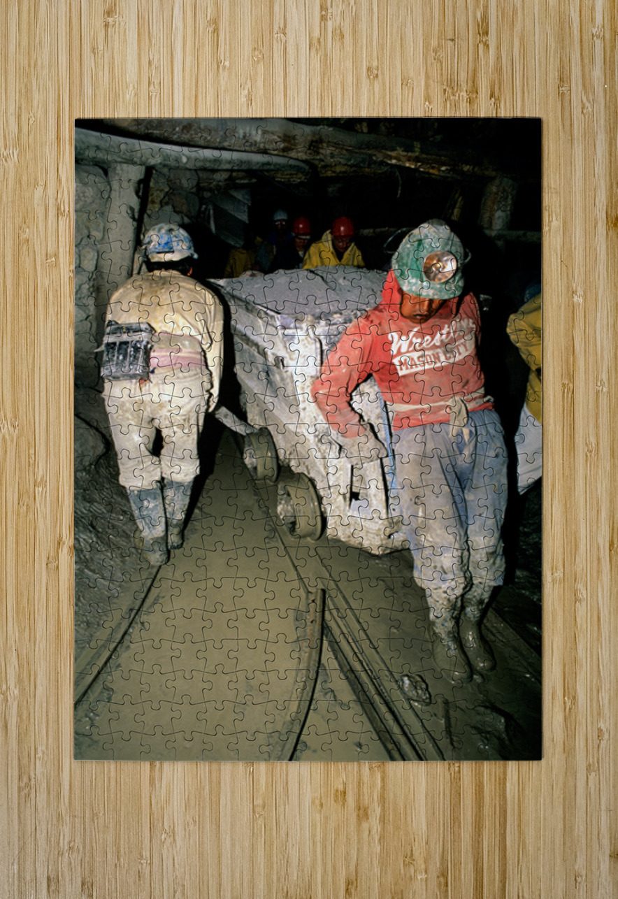 Miners pushing a loaded cart through a muddy underground mine. Marco Brivio Puzzle printing