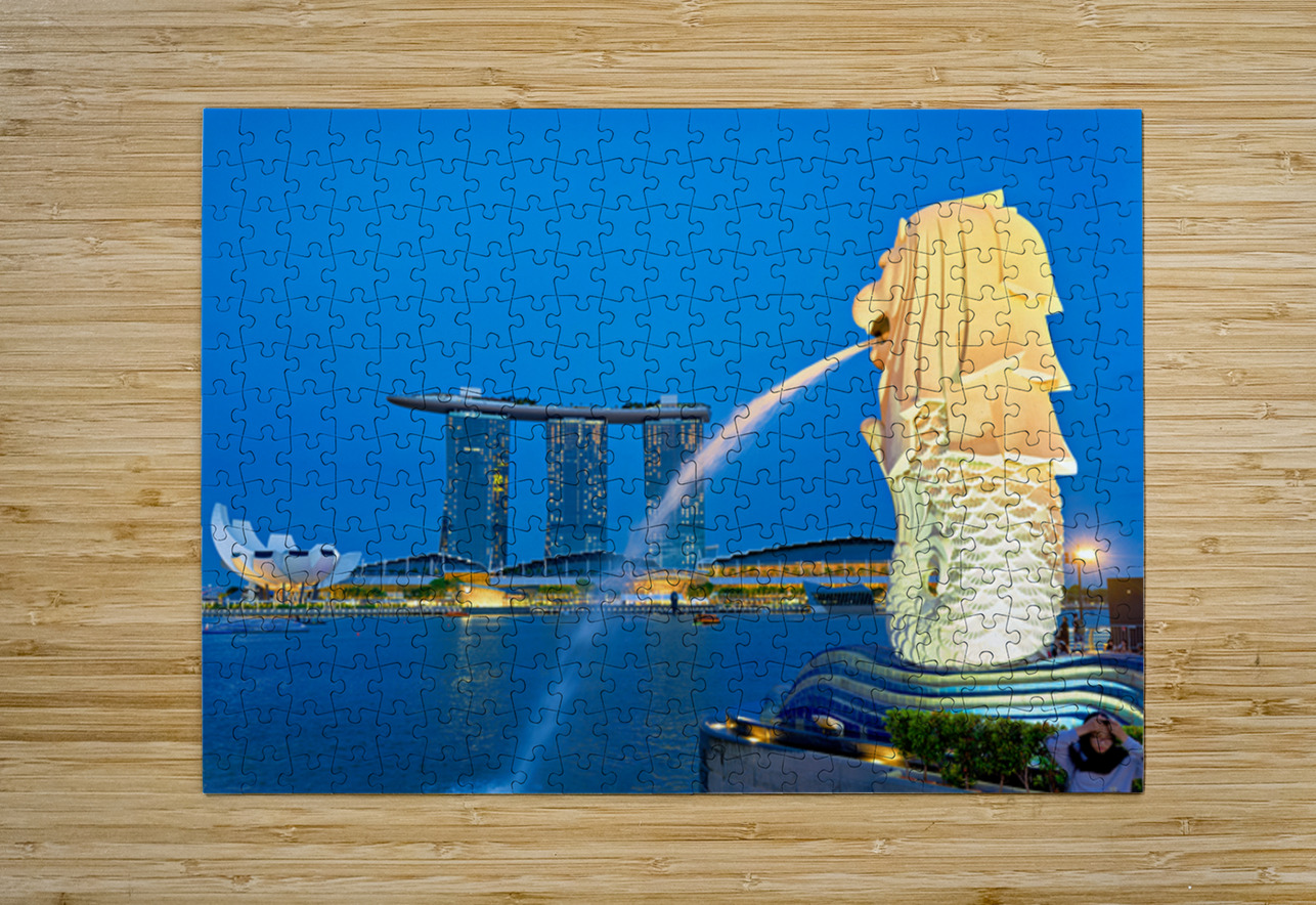 Visitors watch the Merlion fountain at Marina Bay during sunset Marco Brivio Puzzle printing