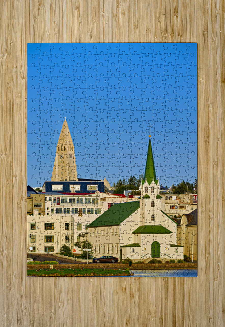 Lutheran free church by lake Tjornin and Halgrimskirkja Marco Brivio Puzzle printing