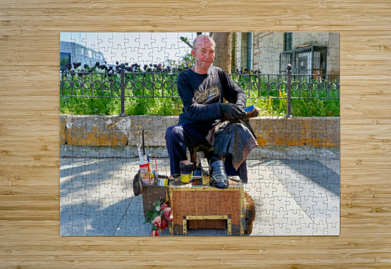 Shoeblack working on shoes in Istanbul Turkey during the day Marco Brivio Puzzle printing